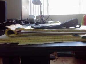 One of the piles of paper on my desk right now